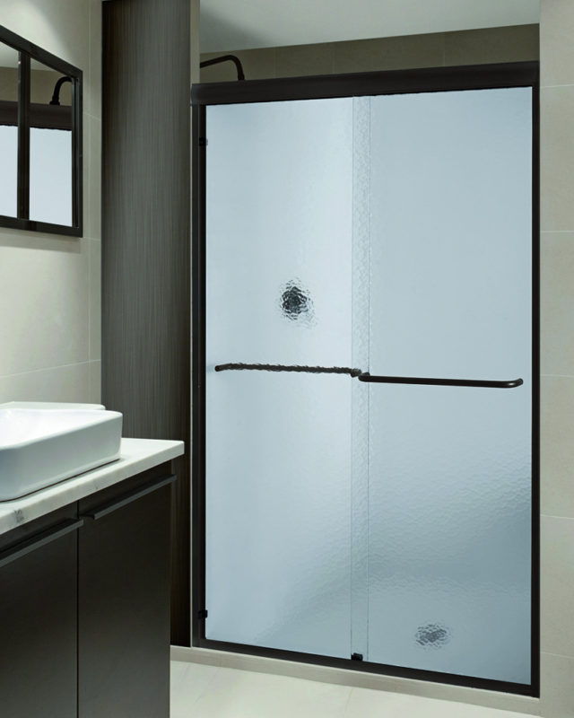 Glass shower doors in bathroom