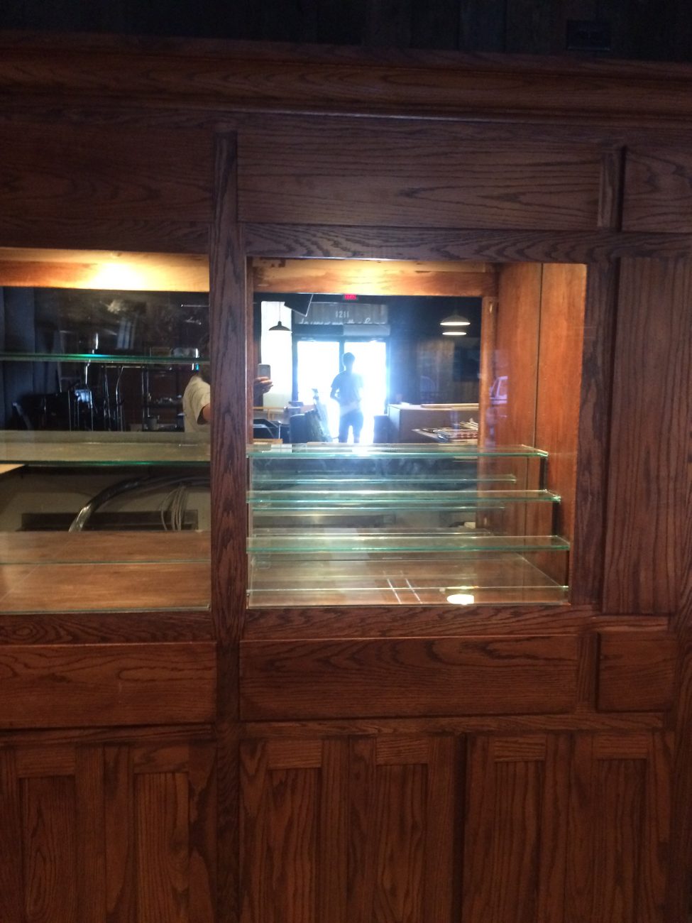 Glass shelving inside wood cabinets