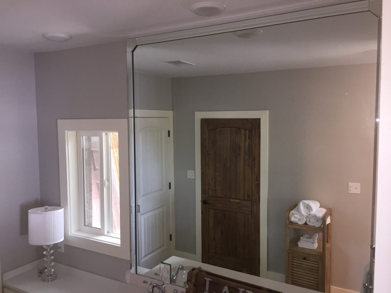 Grey painted kitchen with mirror